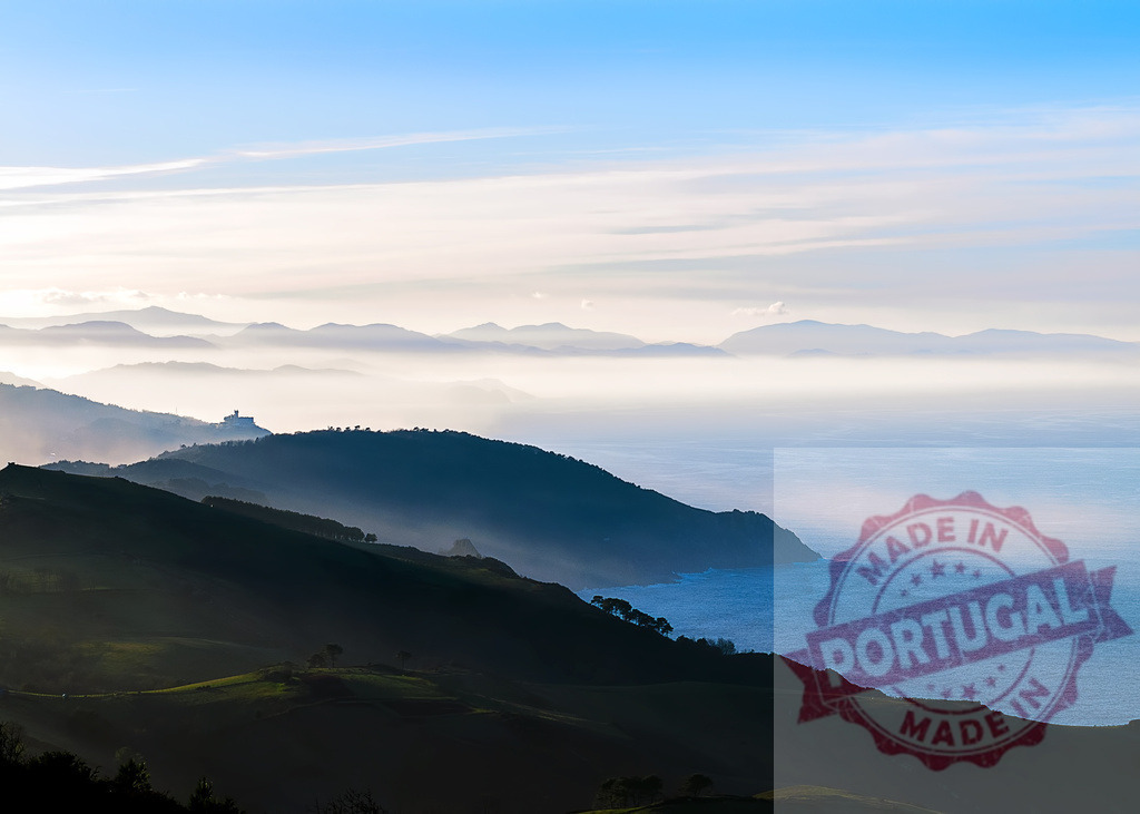 Early morning mist covering mountains by the Cantabrian Sea in Spain | Beautiful landscape with fog covering mountains by the sea in Cantabria, Spain - Realized with Pictrs.com