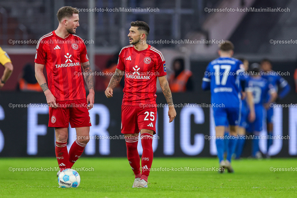 Due20122401111 | 20.12.2024, Fußball, Fortuna Düsseldorf - 1. FC Magdeburg, 2. Bundesliga, Merkur Spiel-Arena, Saison 2024 2025: Andre Hoffmann (Fortuna Düsseldorf #3) neben Matthias Zimmermann (Fortuna Düsseldorf #25)DFB regulations prohibit any use of photographs as image sequences and or quasi-video.