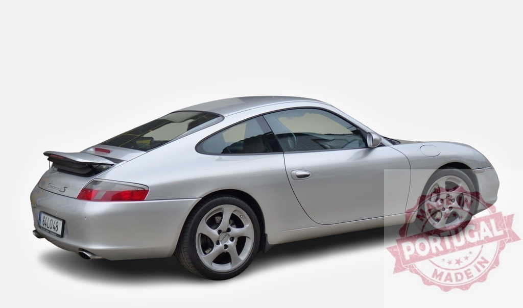Silver Porsche 911 Carrera S standing still on white background | Rear view of a silver Porsche 911 Carrera S standing still on a white background - Realized with Pictrs.com