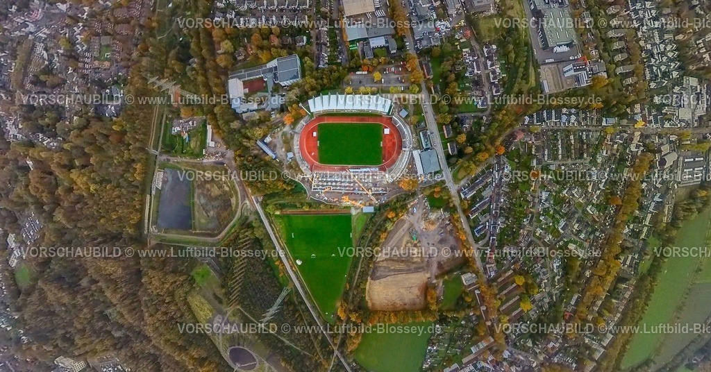 Bochum231190093WattenscheidLohrheideStadion-topaz | Luftbild, Lohrheidestadion Fußballplatz und Leichtathletikstadion der SG Wattenscheid 09, Baustelle mit Neubau Westtribüne und Baustelle mit Umbau Regenrückhaltebecken Wattenscheider Bach, Olympiastützpunkt NRW Westfalen Bochum, RW Rot-Weiß Leithe Fußballverein Baustelle für Renovierung und Neugestaltung der Sportplätze, Wohngebiet Lohrheidestraße mit Baumallee in leuchtenden Herbstfarben, Erdkugel, Fisheye Aufnahme, Fischaugen Aufnahme, 360 Grad Aufnahme, tiny world, little planet, fisheye Bild, Leithe, Bochum, Ruhrgebiet, Nordrhein-Westfalen, Deutschland