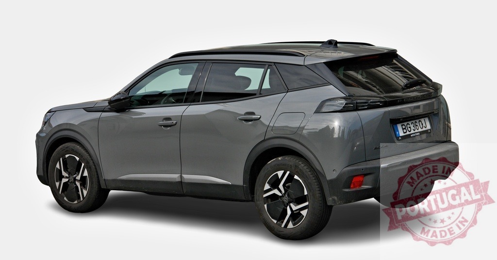 Brand new Peugeot 2008 SUV car parked on white background | Modern gray Peugeot 2008 SUV car parked on white background, showcasing its sleek design - Realized with Pictrs.com