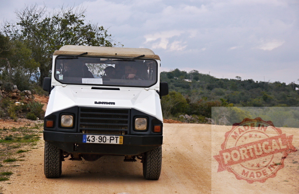 Portuguese UMM off-road vehicle driving on dirt track | Portuguese UMM off-road vehicle travelling on a rural dirt path through the countryside - Realized with Pictrs.com