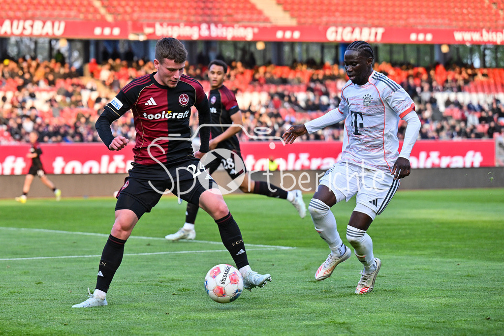 1. FC Nürnberg II - FC Bayern Amateure | NÜRNBERG, GERMANY - 21. APRIL: im Duell Luka LOCHOSHVILI (1. FC Nuernberg 24) und Bajung DARBOE (FC Bayern München II 7) während dem Match zwischen dem 1. FC Nürnberg II und den Amateuren des FC Bayern am 30. Spieltag der Regionalliga Bayern im Max-Morlock Stadion