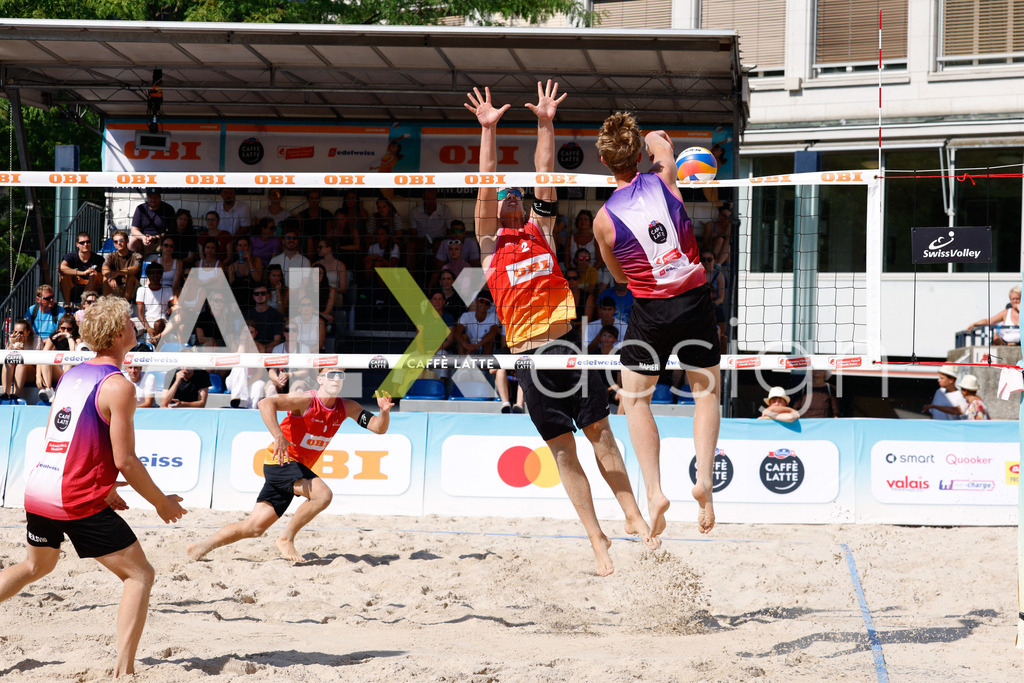 Obi BeachTour 2026 - Basel | BASEL, SWITZERLAND - JULY 17: VILLADS FLÜGGE NAPIER (DEN) attack / spike against MATHIS KÄLIN (SUI) block during the Obi BeachTour 2026 match between BREER / KÄLIN (SUI) and NAPIER / PETERSEN (DEN) at Barfüsserplatz on July 17, 2026 in Basel, Switzerland. - Realisiert mit Pictrs.com