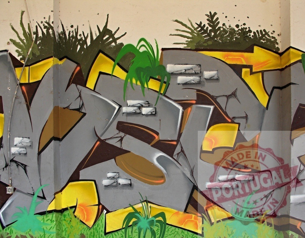Colorful wildstyle graffiti art abstract wall painting | Urban wall covered with vibrant abstract letters and green natural elements - Realized with Pictrs.com