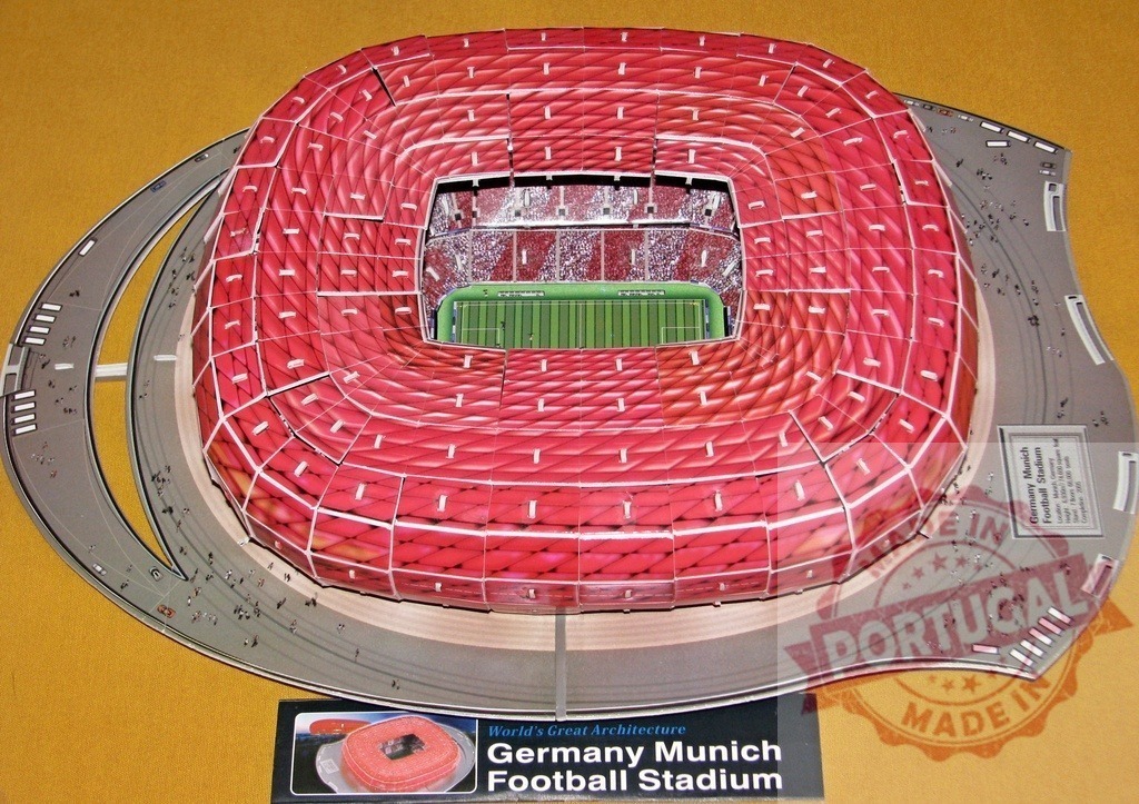 Scale model of Allianz Arena, Munich Football Stadium, showing red inflatable ETFE cushions | Aerial view of a scale model of Allianz Arena, home of FC Bayern Munich, highlighting the innovative red inflatable ETFE facade - Realisiert mit Pictrs.com