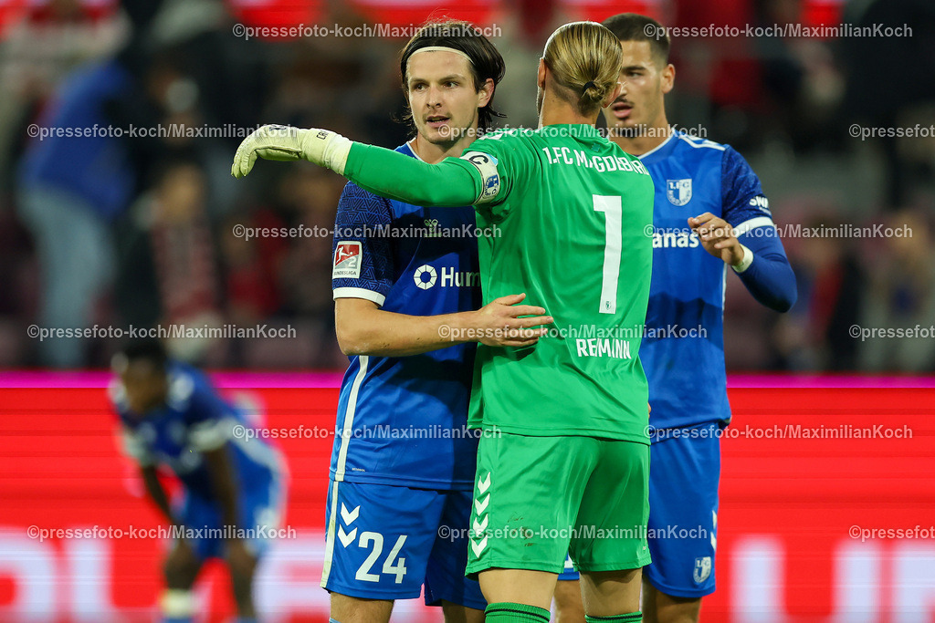 Koe14092401052 | 14.09.2024, 2. Fußball Bundesliga, 1. FC Köln - 1. FC Magdeburg, RheinEnergieSTADION, Saison 2024 2025: Jean Hugonet (1.FC Magdeburg #24) und Torwart Dominik Reimann (1.FC Magdeburg #1) freuen sich nach dem 2:1 SiegDFB regulations prohibit any use of photographs as image sequences and or quasi-video.