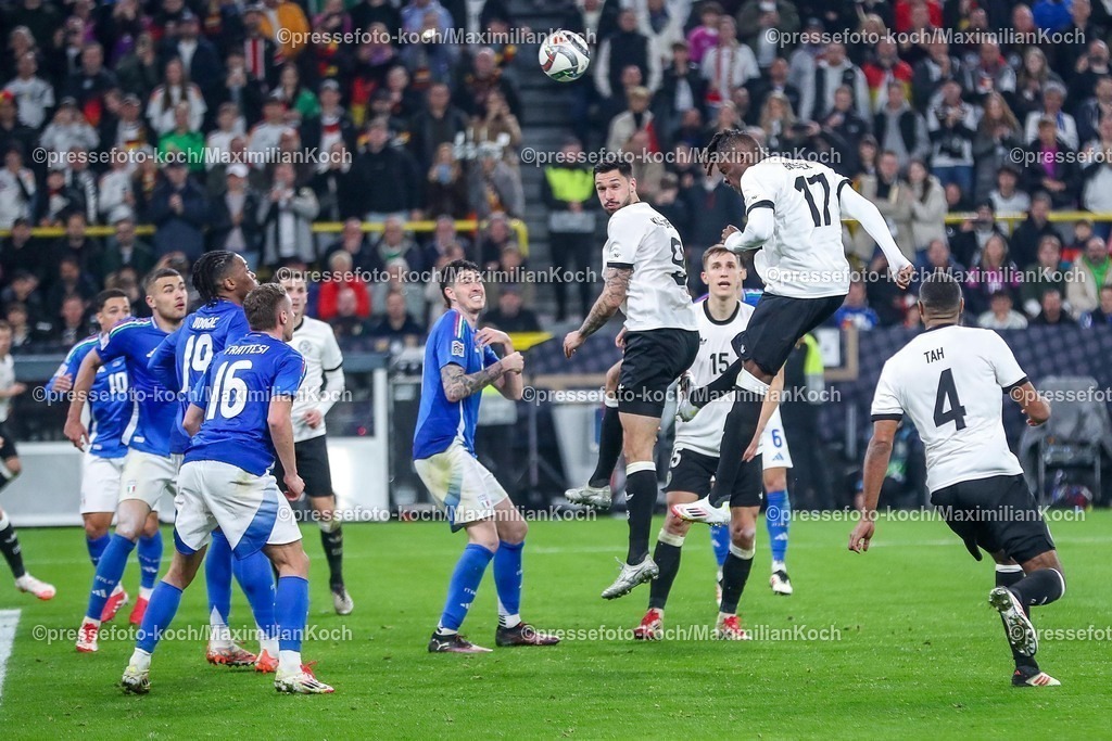 DFB23032501101 | 23.03.2025, Fußball, Viertelfinale UEFA Nations League, Deutschland - Italien, Signal Iduna Park, Saison 2024 2025: Strafraumaktion Kopfball Tim Kleindienst (GER #09) Yann Aurel Bisseck (GER #17) DFB regulations prohibit any use of photographs as image sequences and or quasi-video.