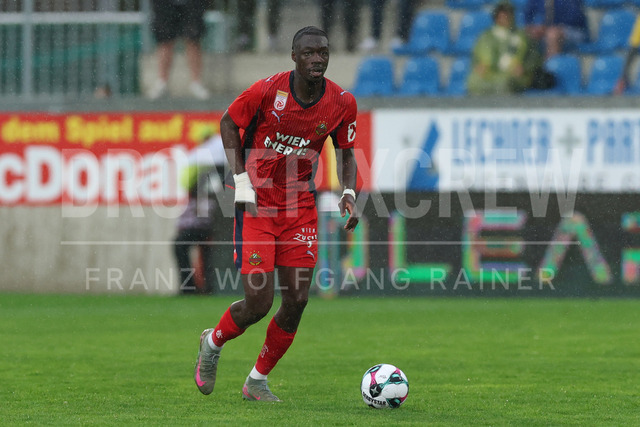 TSV Egger Glas Hartberg vs SK Rapid Wien – Championship Group    | Hartberg, Austria, 19.Apr.26 - SOCCER - ADMIRAL Bundesliga, TSV Egger Glas Hartberg vs SK Rapid Wien. The image shows Serge-Philippe Raux-Yao (SK Rapid Wien) in rain. 