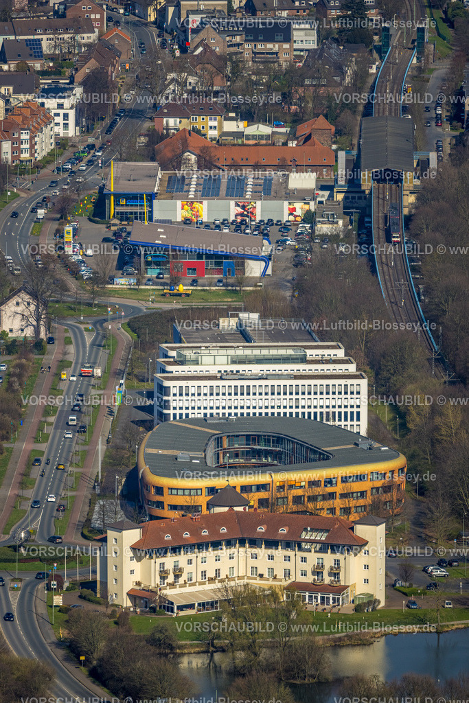 Duisburg240303071 | Luftbild, Gewerbegebiet mit Hotel Landhaus Milser, VBG-Bezirksverwaltung Duisburg, Xella International GmbH und Edeka E-Center Angerbogen, überdachter Bahnhof Angerbogen, Huckingen, Duisburg, Ruhrgebiet, Nordrhein-Westfalen, Deutschland, Duisburg-S
