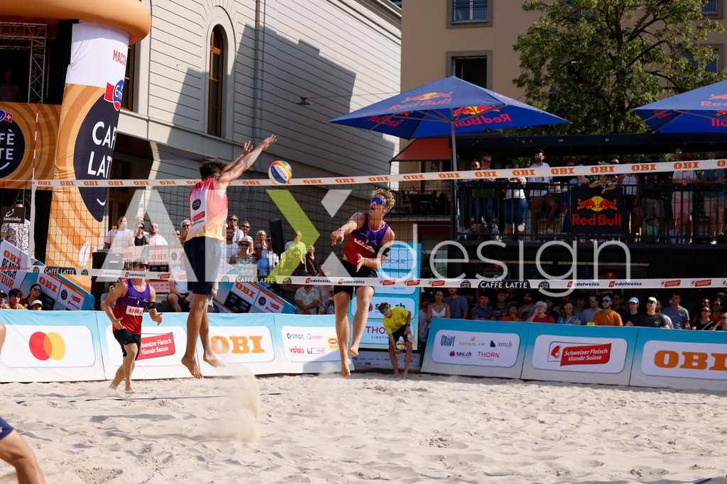 Obi BeachTour 2026 - Basel | BASEL, SWITZERLAND - JULY 19: MATHIS KÄLIN (SUI) attack / spike against LUC EMANUEL FLÜCKIGER (SUI) during the Obi BeachTour 2026 match between DILLIER / FLÜCKIGER (SUI) and BREER / KÄLIN (SUI) at Barfüsserplatz on July 19, 2026 in Basel, Switzerland. - Realisiert mit Pictrs.com