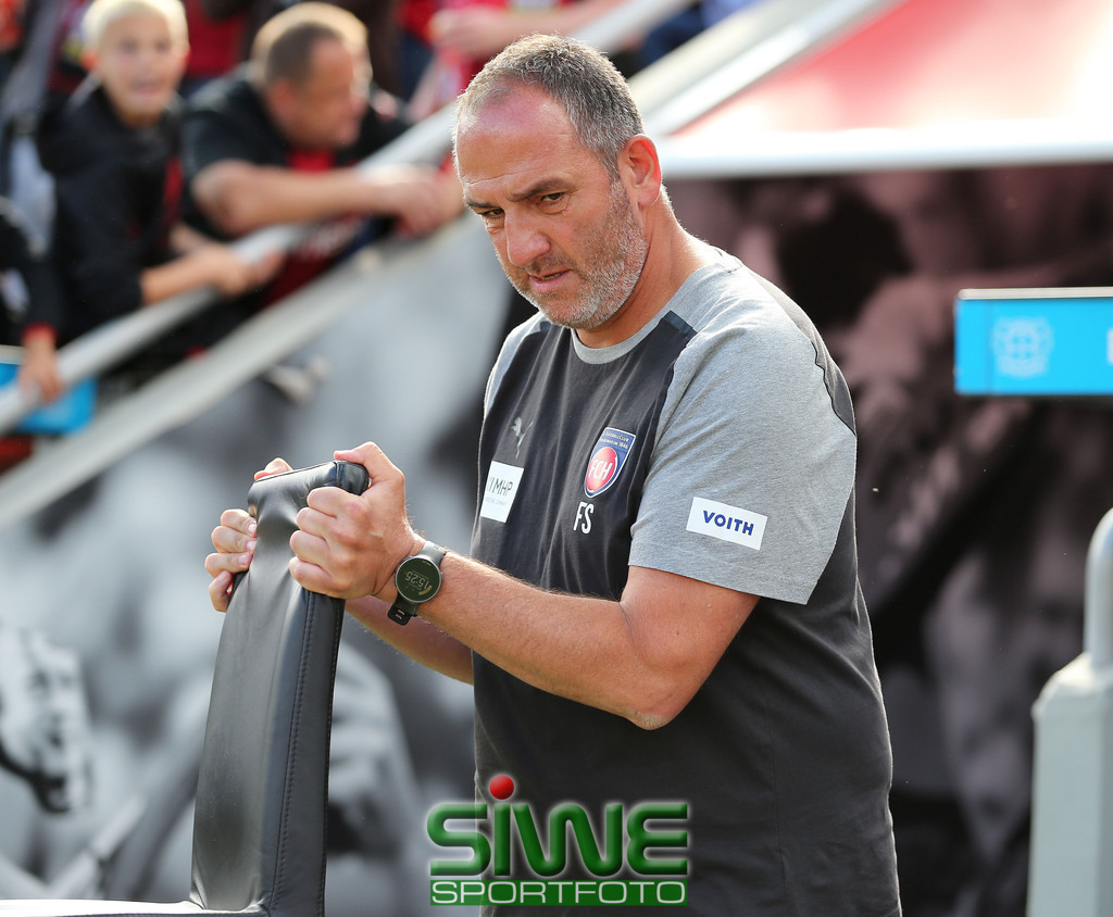 1.Fussball-Bundesliga  :    Bayer 04 Leverkusen--1.FC Heidenheim   5.Spltg. | 24.09.2023; Fussball; GER;  Saison 2023/2024 ; 1.Bundesliga;  5.Spieltag. : 
 Bayer 04 Leverkusen ---1.FC Heidenheim  :    Frank Schmidt (TR/HDH)  bringt bseinen Stuhl in Position.

DFL REGULATIONS PROHIBIT ANY USE OF PHOTOGRAPHS AS IMAGE SEQENCES AND/OR QUASI-VIDEO. - Realisiert mit Pictrs.com