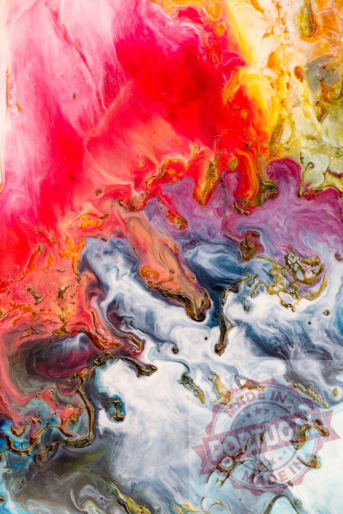 Abstract colorful acrylic pouring painting creating unique shapes | Fluid painting mixing bright colors and gold creating a unique abstract composition - Realized with Pictrs.com