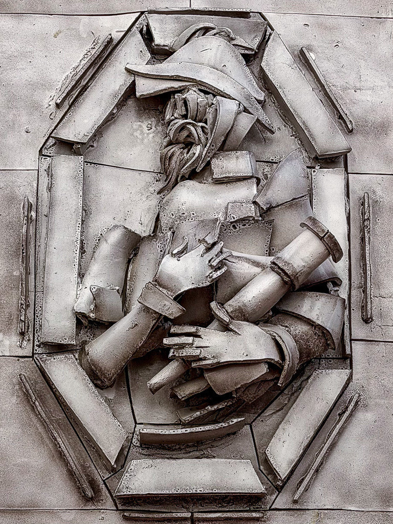 Hidden Relief in Monaco | An enigmatic wall relief discovered on the Palace Hill in Monaco. The fragmented forms and weathered textures create a surreal composition between sculpture, memory and hidden symbolism. ✨ - Realisiert mit Pictrs.com