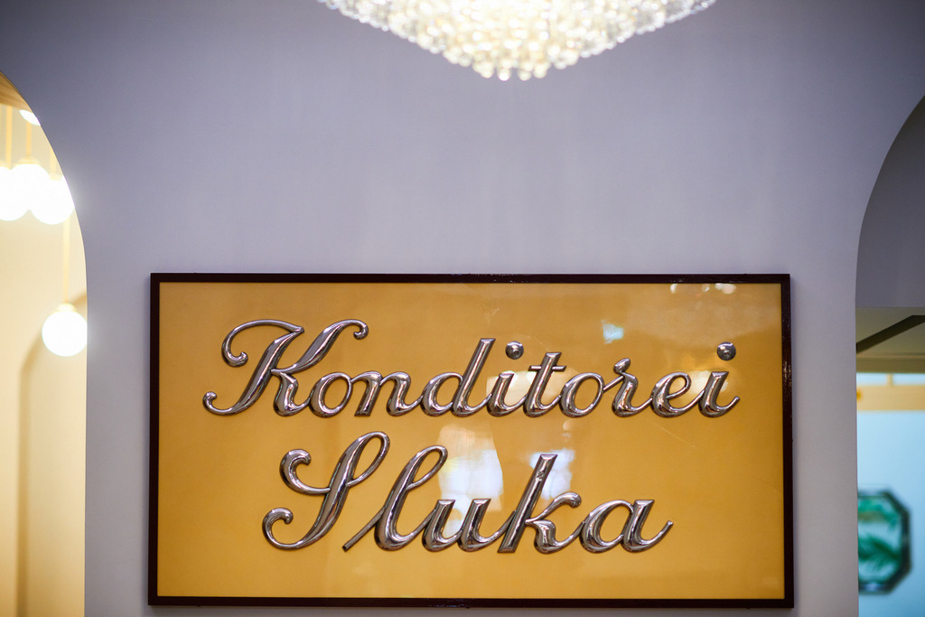 Cafe Sluka | Wien, Austria - March 28, 2018: Conditorei Sluka; Schild mit Aufschrift Konditorei Sluka an der Wand. - Realisiert mit Pictrs.com