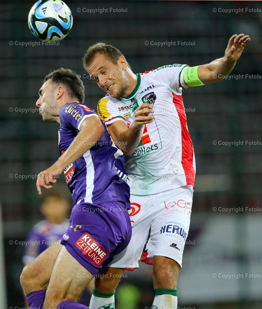 A_LUI_090823_01 | SPORT,FUSSBALL,ADMIRAL BUNDESLIGA AUSTRIA KLAGENFURT 09.08.2023 IM BILD:ANDREW IRVING (KLAGENFURT) UND MARIO LEITGEB (WAC) FOTO:FOTOLUI/MW