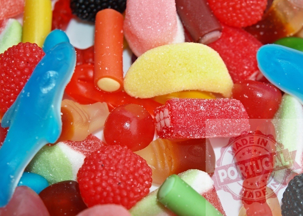 Colorful chewy sugary candies creating a sweet mix | Assorted vibrant candies close-up full frame showing a variety of sweets - Realized with Pictrs.com