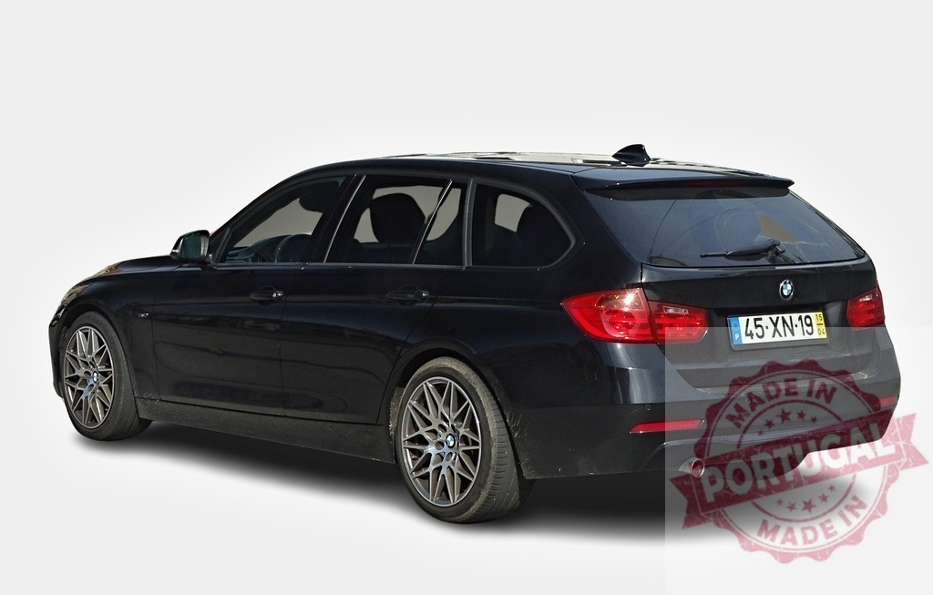 Black BMW 3 Series Touring parked on white background | Modern black BMW 3 Series Touring car parked on a white background, showcasing its sleek design and estate functionality - Realized with Pictrs.com
