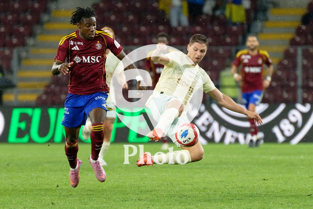 UEFA Conference League Play-offs 2nd leg - Servette FC v FC Shakhtar Donetsk | Valeriy Bondar (5 FC Shakhtar Donetsk) Tiemoko Ouattara (17 Servette FC) battle for the ball (duel)  during the UEFA Conference League Play-offs 2nd leg match between Servette FC and FC Shakhtar Donetsk at Stade de Geneve in Geneva, Switzerland