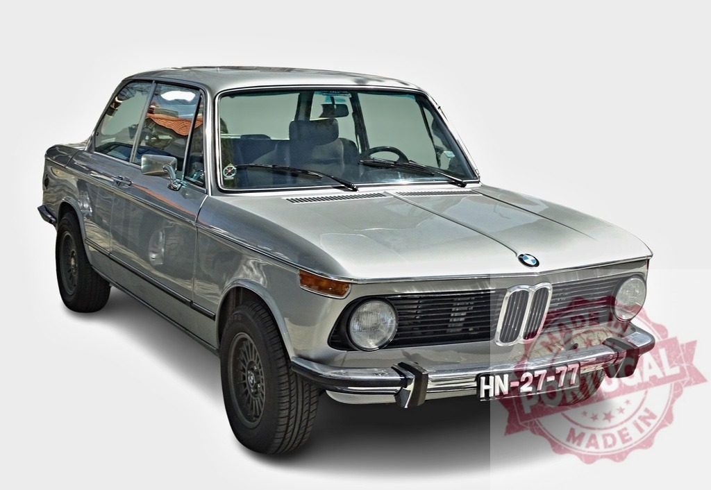 Classic BMW 2002 posing elegantly, showcasing its vintage charm | Silver BMW 2002 exhibiting its timeless design on a white background - Realisiert mit Pictrs.com