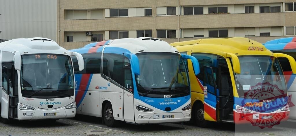 Rede Expressos and Avic coaches at bus station | Modern Irizar coaches parked at a bus terminal, ready for travel - Realisiert mit Pictrs.com
