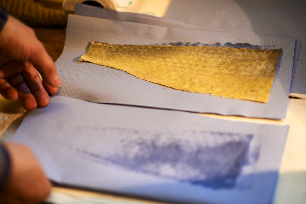 Yupitaze Fischtextil | Litschau, Austria - April 02, 2016: Yupitaze Fischtextil; das Fischleder auf dem saugfähige Papier, nach dem pressen hat sich das Fett gelöst. - Realisiert mit Pictrs.com
