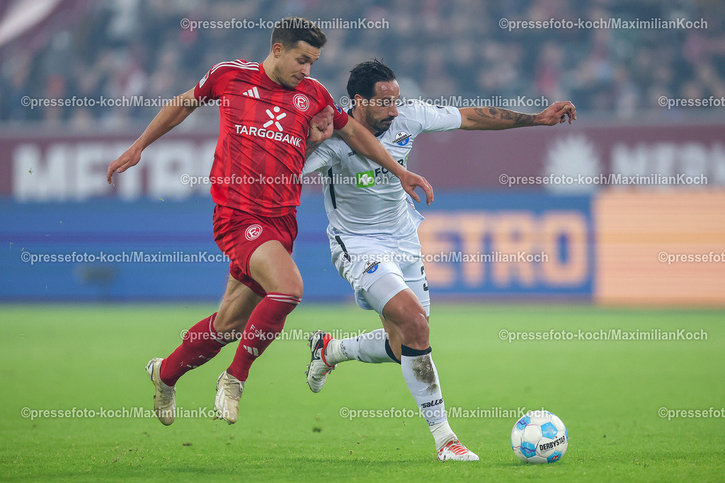 Due09112401032 | 09.11.2024, Fußball, Fortuna Düsseldorf - SC Paderborn 07, 2. Bundesliga, Merkur Spiel-Arena, Saison 2024 2025: Zweikampf zwischen Tim Oberdorf (Fortuna Düsseldorf #15) gegen  Adriano Grimaldi (Paderborn #39)DFB regulations prohibit any use of photographs as image sequences and or quasi-video.