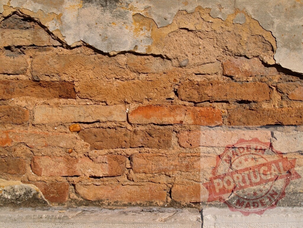Old damaged brick wall with crumbling plaster revealing bricks underneath | Crumbling plaster reveals old bricks underneath, creating a textured background with warm hues - Realized with Pictrs.com