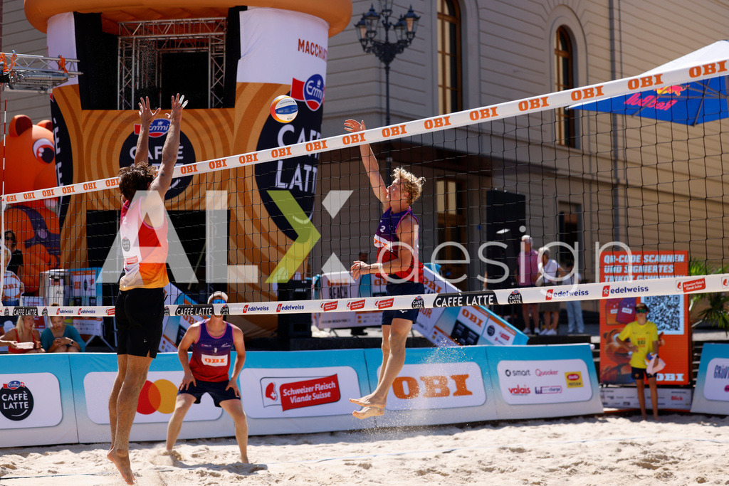 Obi BeachTour 2026 - Basel | BASEL, SWITZERLAND - JULY 18: JACOB HEJLSVIG PETERSEN (DEN) attack / spike during the Obi BeachTour 2026 match between ALLEMANN / LEFFLER (SUI) and MASSEREY / SCHNEGG (SUI) at Barfüsserplatz on July 18, 2026 in Basel, Switzerland. - Realisiert mit Pictrs.com