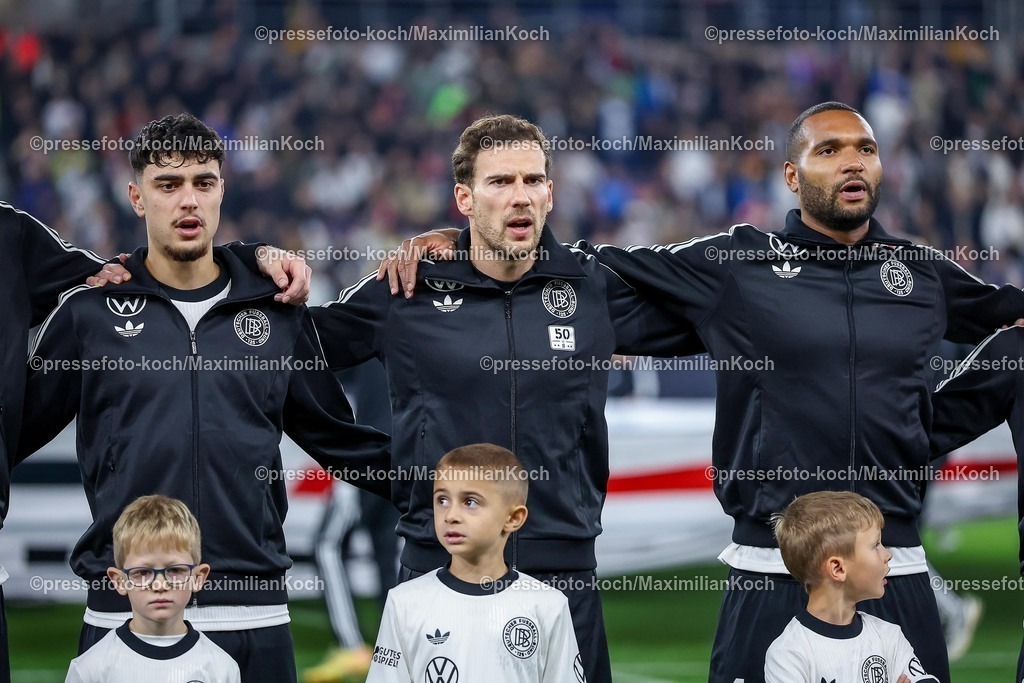 DFB10102502136 | 10.10.2025, Fußball, Länderspiel, Deutschland - Luxemburg, UEFA WM-Qualifikation, 2025/2026, Gruppe A, PreZero Arena in Sinsheim: Aleksandar Pavlovic (GER #05) neben Leon Goretzka (GER #08) und Jonathan Tah (GER #04) bei der NationalhymneDFB regulations prohibit any use of photographs as image sequences and or quasi-video.