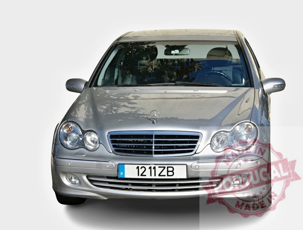 Silver Mercedes-Benz C-Class W203 elegance parked, showing its front | Frontal view of a silver Mercedes-Benz C-Class W203 elegance parked, embodying luxury and style - Realisiert mit Pictrs.com