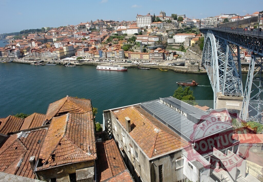 Porto cityscape with Dom Luis I Bridge across Douro River | Porto cityscape featuring the Dom Luis I Bridge spanning the Douro River, historic Ribeira buildings - Realized with Pictrs.com