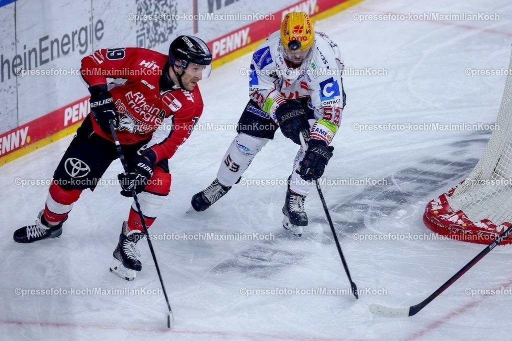 KEC24032501011 | 24.03.2025, Eishockey, DEL Play-offs, Kölner Haie - Fischtown Pinguins Bremerhaven, Viertelfinale Spiel 4, Lanxess-Arena Köln: Frederik Storm (Kölner Haie #19) im Zweikampf gegen Maxim Rausch (Fischtown Pinguins #53) 
