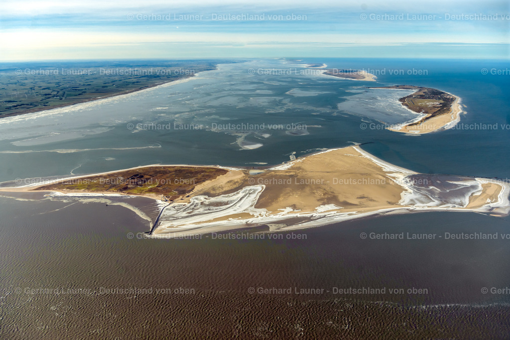 4044409 | WANGEROOGE 14.02.2021 Mit Buhnen befestigter sandiger Küstenbereich der Nordsee- Insel Minsener Oog, die zum Nationalpark Niedersächsisches Wattenmeer gehört, im Bundesland Niedersachsen. // Groin mounted coastal area of the North Sea island Minsener Oog  belonging to the Nationalpark Niedersaechsisches Wattenmeer in the state Lower Saxony. Foto: Gerhard Launer