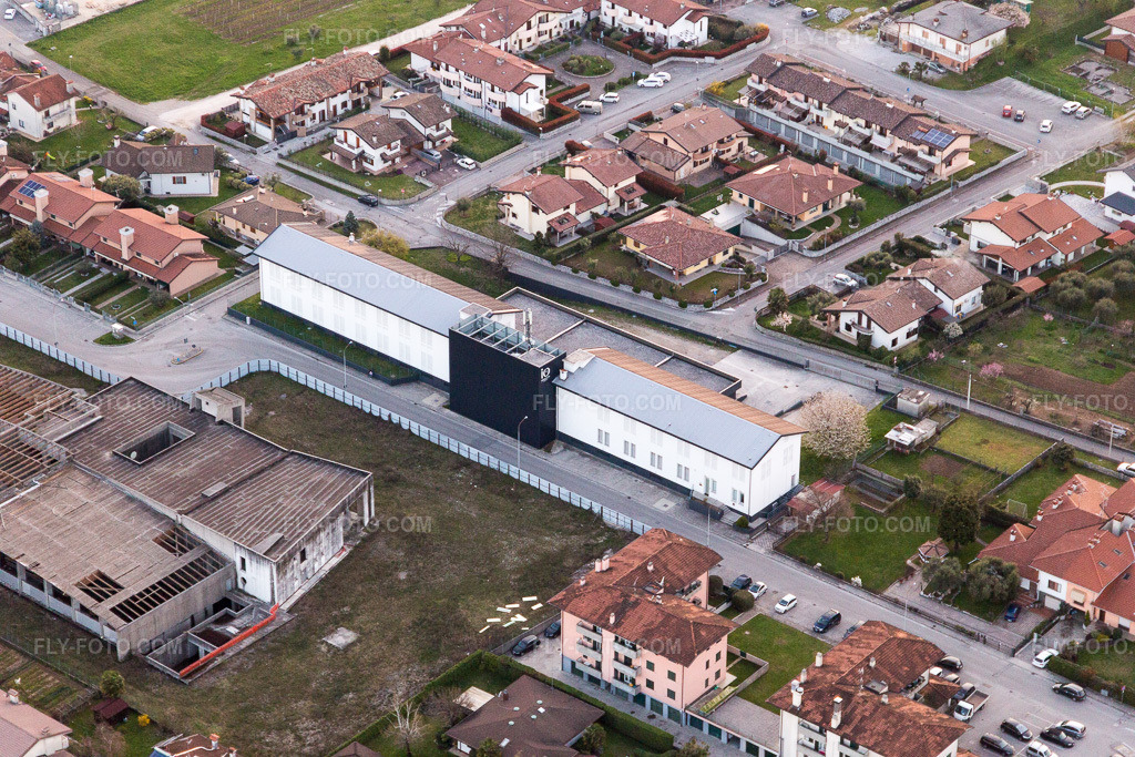 Aerial view: Warehouses for the maturation of ham in the industrial area of Prosciuttificio Friulano and Leoncini Prosciutti in San Daniele del Friuli in the state Udine, Italy.Photo: IMG_105629.jpg taken on 04/07/2018 by Werner Riehm/FLY-FOTO.comResolution of the original: 5472 x 3648 px