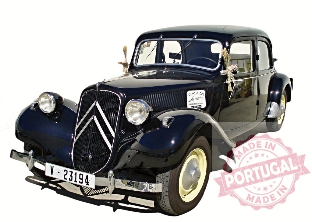 Restored Citroën Traction Avant showing its elegance | Classic black Citroën Traction Avant car parked, showing its restored beauty and decorated for a ceremony - Realisiert mit Pictrs.com