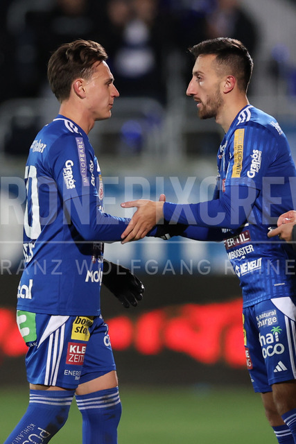 TSV Egger Glas Hartberg vs SV Oberbank Ried – Austrian Bundesliga Match | The image shows Lukas Fridrikas (Hartberg) and Patrik Mijic (Hartberg), at the Bundesliga match TSV Hartberg vs SV Ried at Profertil Arena Hartberg. 22.11.2025