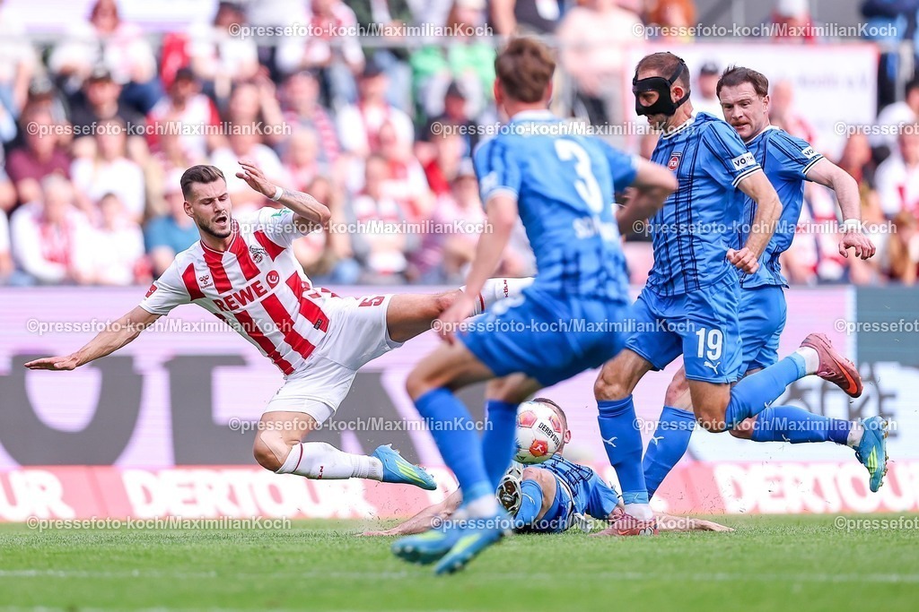 1FC10052601048 | 10.05.2026, Fußball, 1. FC Köln - 1. FC Heidenheim, 1. Fußball Bundesliga Herren, 33. Spieltag, RheinEnergie-STADION, Saison 2025 / 2026: Tom Krauß&nbsp;(1FC Koeln #05) im Zweikampf gegen  Arijon Ibrahimovic&nbsp; (FC Heidenheim #22) Jonas Föhrenbach&nbsp; (FC Heidenheim #19) Budu Zivzivadze&nbsp; (FC Heidenheim #11)  DFB regulations prohibit any use of photographs as image sequences and or quasi-video.