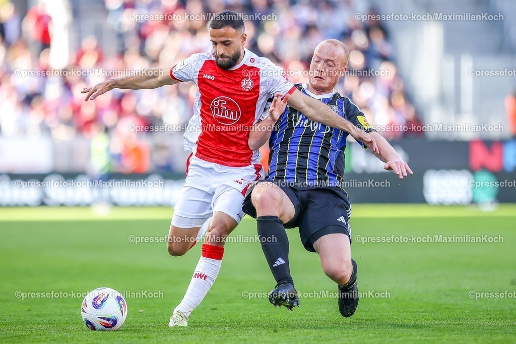 xKWIx26042601034 | 2026.04.26, xkwix, Fußball, 3.Liga, Rot-Weiss Essen - 1. FC Saarbrücken, Stadion an der Hafenstraße, 35.Spieltag, Saison 2025 / 2026: Sebastian Vasiliadis (1. FC Saarbrücken #19) ringt im Zweikampf Ramien Safi (Rot-Weiss Essen #7) nieder DFB regulations prohibit any use of photographs as image sequences and or quasi-video. Photo: xKamilxWilkowskixPressefotoKochx