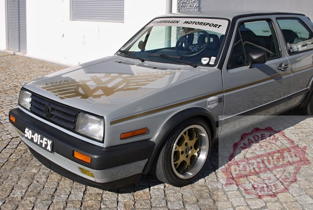 Volkswagen Golf Mk2 custom car on cobblestone street | Volkswagen Golf Mk2 custom car parked on a traditional cobblestone street creating a retro urban scene - Realized with Pictrs.com