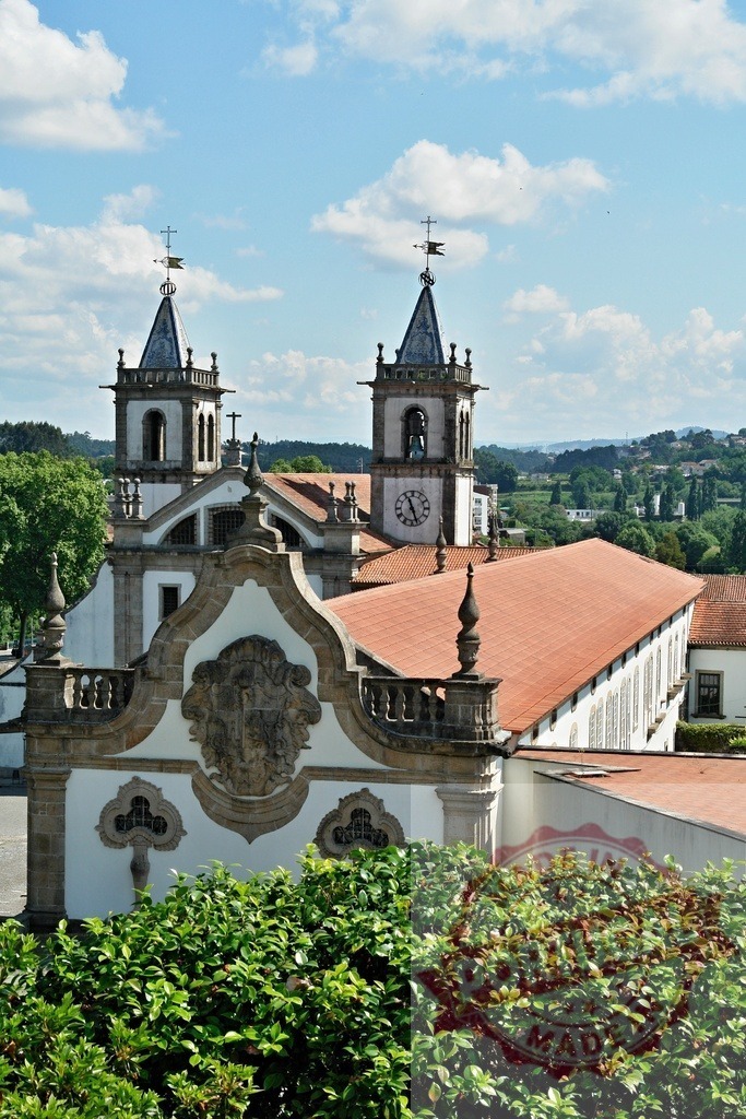Bom Jesus do Monte church and sanctuary facade in Braga. Portugal - Norte | Bom Jesus do Monte church building stands tall under a blue sky in Braga, Portugal - Realized with Pictrs.com