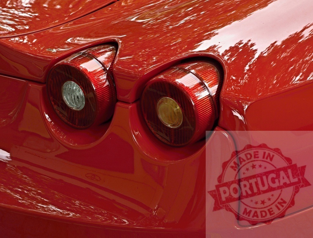 Ferrari sports car red taillights reflecting nature | Red Ferrari sports car rear and round taillights reflecting trees and sky - Realized with Pictrs.com