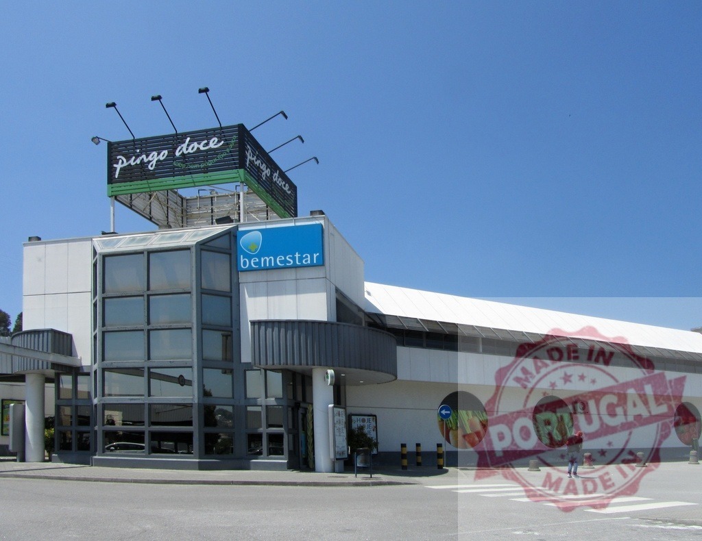 Pingo Doce supermarket building in Portugal on sunny day | Pingo Doce supermarket exterior featuring bemestar sign and produce circles under blue sky - Realisiert mit Pictrs.com