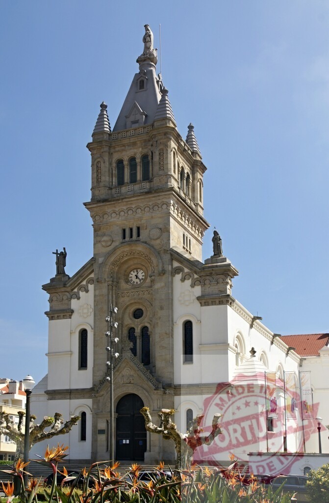 Espinho church facade with bell tower against blue sky | Parish church of Espinho featuring its grand facade, clock, and bell tower under a bright sky - Realized with Pictrs.com