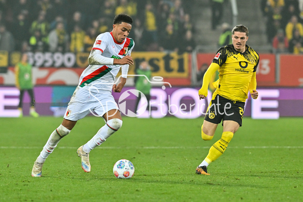 FC Augsburg - Borussia Dortmund | AUGSBURG, GERMANY - Noahkai BANKS (FC Augsburg 40) against Marcel SABITZER (Borussia Dortmund 20) during the bundesliga match between FC Augsburg vs. Borussia Dortmund on matchday 9 at WWK Arena on October 31, 2025 in Augsburg, Germany / DFL REGULATIONS PROHIBIT ANY USE OF PHOTOGRAPHS AS IMAGE SEQUENCES AND/OR QUASI-VIDEO