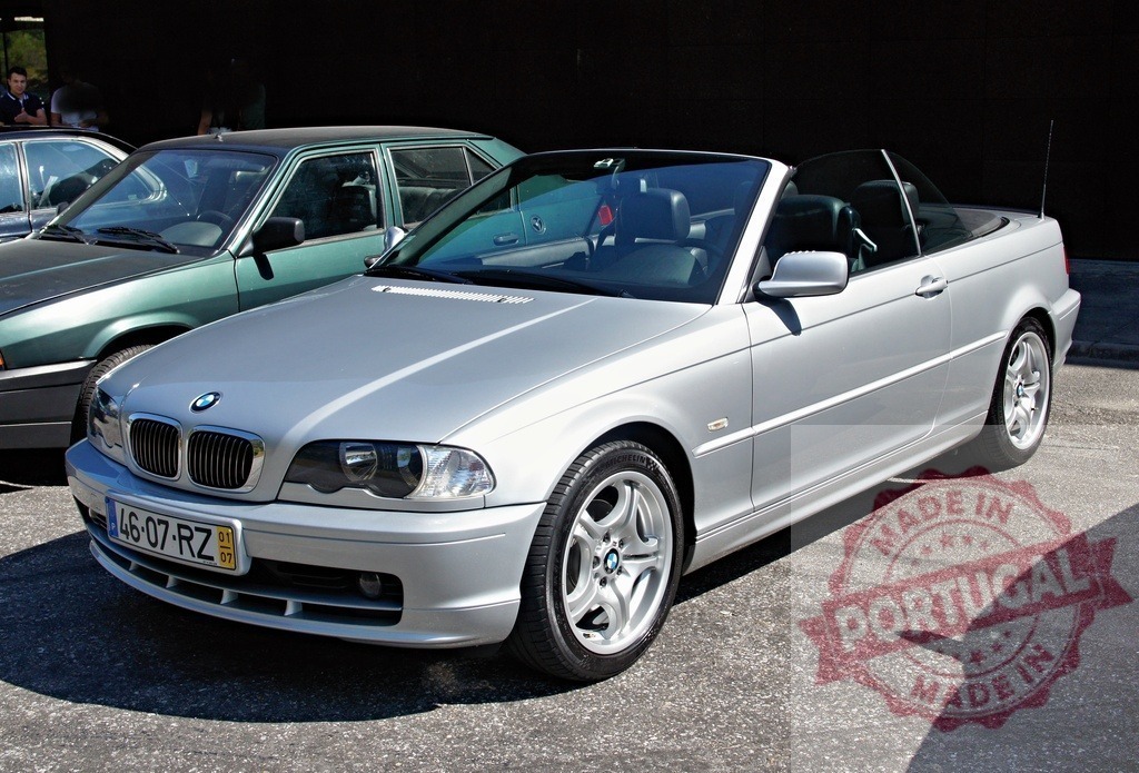 Silver BMW 3 Series Convertible parked near other cars | Stylish silver BMW 3 Series convertible parked outdoors, showcasing its sleek design and open-top elegance - Realized with Pictrs.com