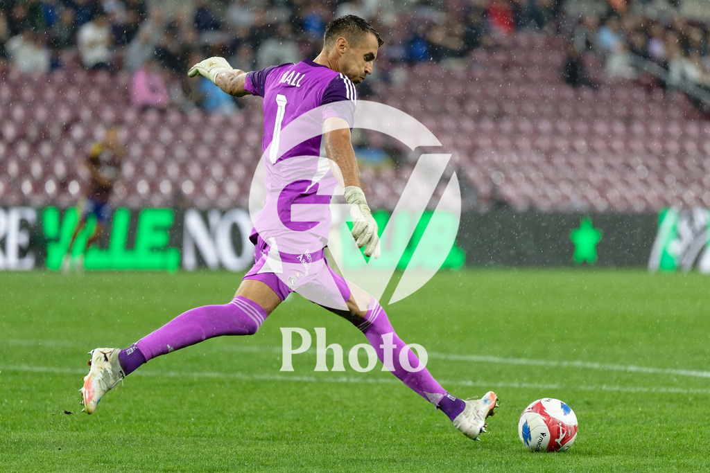 UEFA Conference League Play-offs 2nd leg - Servette FC v FC Shakhtar Donetsk | Joel Mall (1 Servette FC) shoots the ball (action)  during the UEFA Conference League Play-offs 2nd leg match between Servette FC and FC Shakhtar Donetsk at Stade de Geneve in Geneva, Switzerland