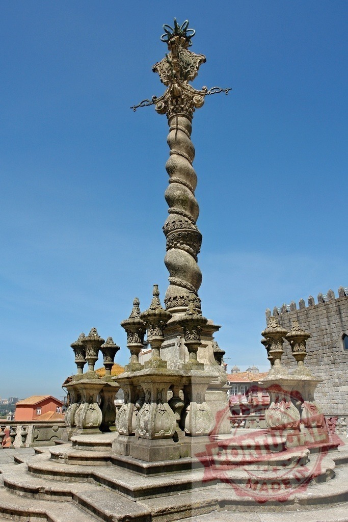 Pelourinho do Porto Manueline pillar in Portugal. Porto - Portugal | Pelourinho do Porto, a manueline pillory, stands against a clear blue sky - Realized with Pictrs.com