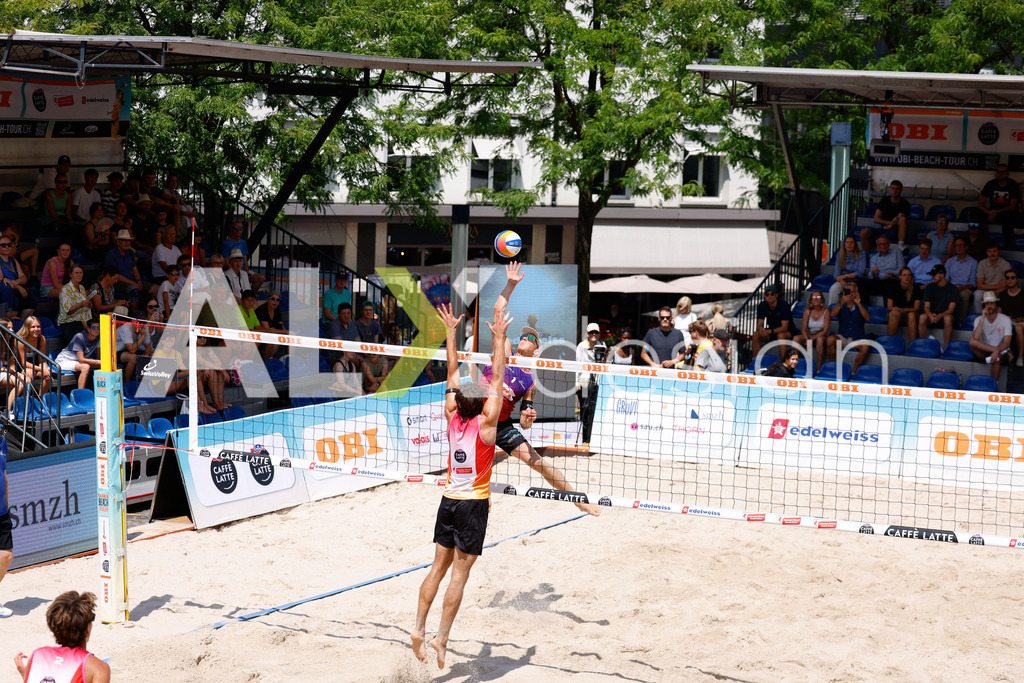 Obi BeachTour 2026 - Basel | BASEL, SWITZERLAND - JULY 17: NOAH YANNIK ALOIS FURRER (SUI) attack / spike against DANIEL ALLEMANN (SUI) blocking during the Obi BeachTour 2026 match between ALLEMANN / LEFFLER (SUI) and FURRER / WYMANN (SUI) at Barfüsserplatz on July 17, 2026 in Basel, Switzerland. - Realisiert mit Pictrs.com