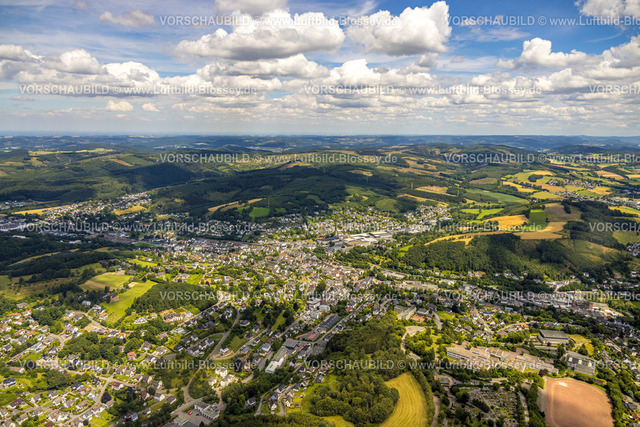 Sundern240708980 | Luftbild, Ortsansicht Sundern in malerischer Hügellandschaft, Wiesen und Wälder, Fernsicht und blauer Himmel mit Wolken, Sundern, Sauerland, Nordrhein-Westfalen, Deutschland